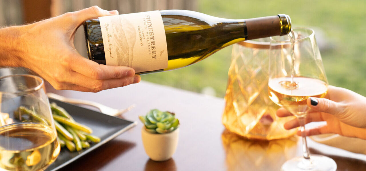 Pouring a glass of Chardonnay wines